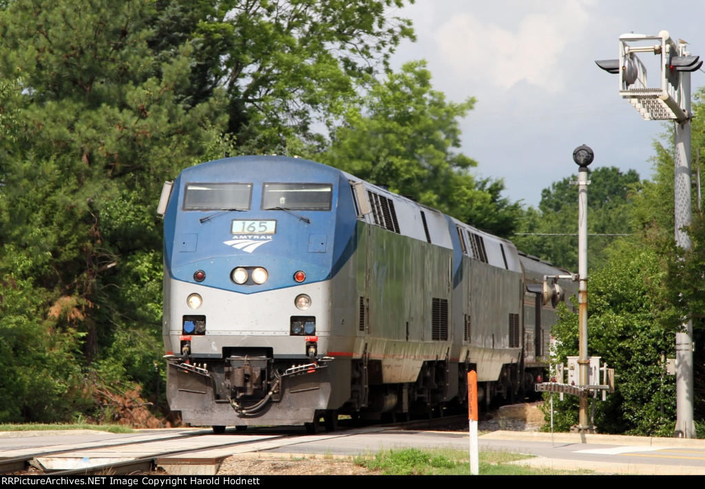 AMTK 165 leads train P092 away from the station